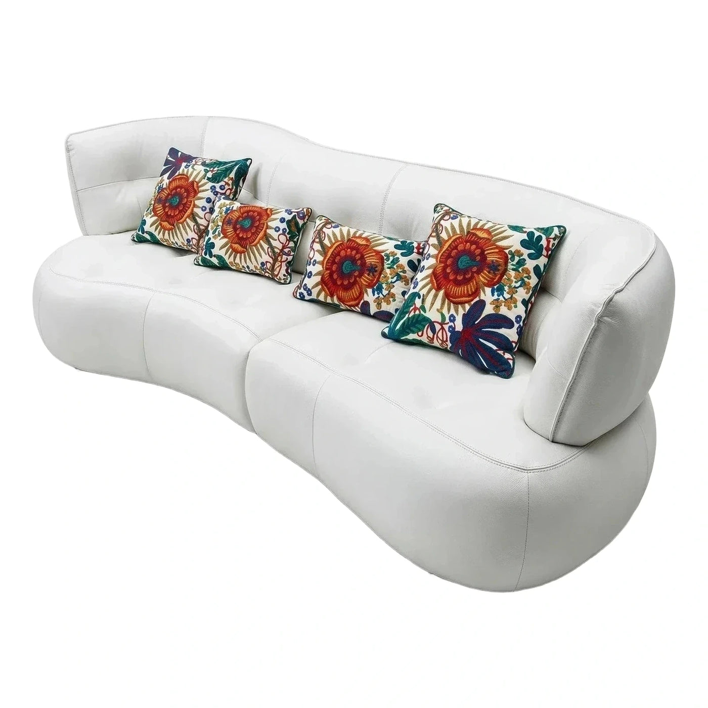 Modern White Curved Leather Sofa with Floral Pillows