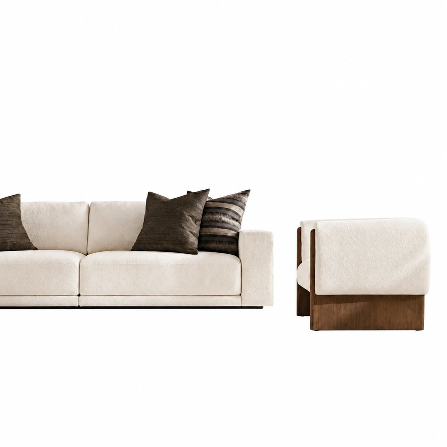 Cream Fabric Sofa with Wooden Base and Accent Pillows