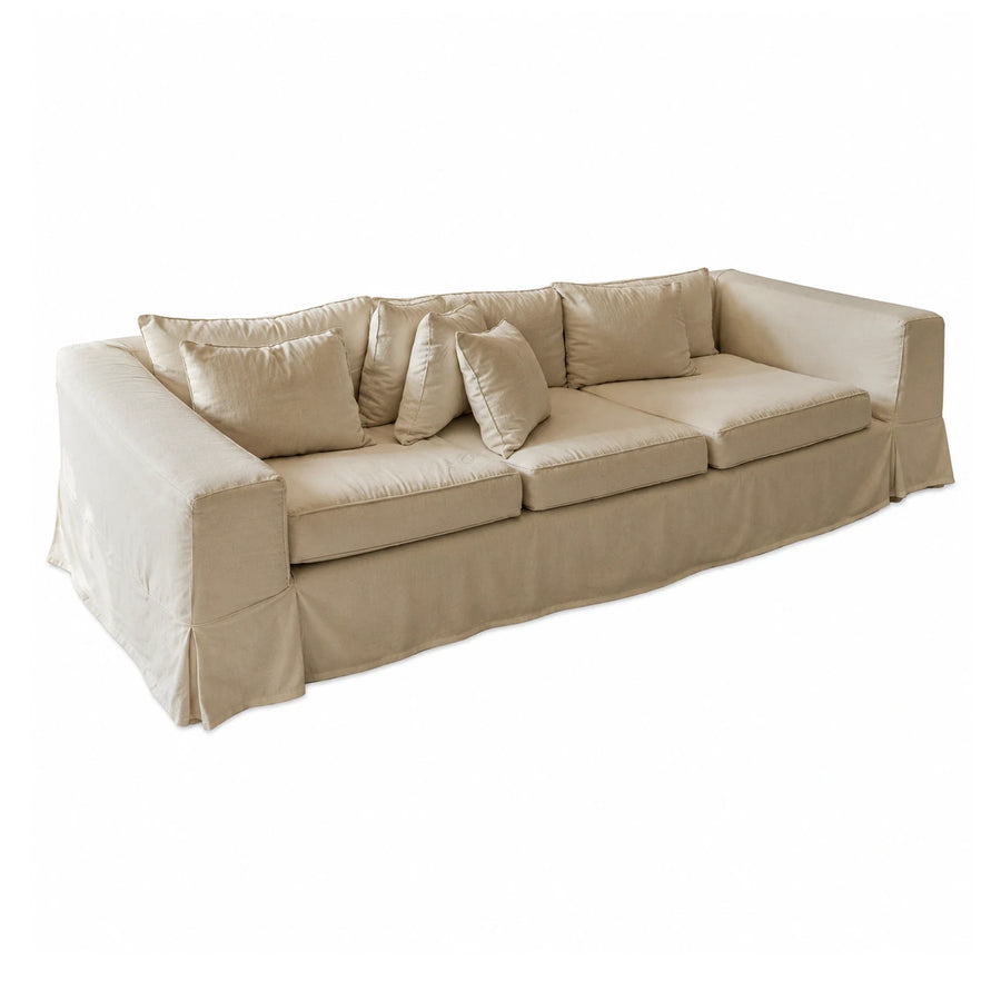 Beige Fabric Sofa with Skirted Base and Throw Pillows