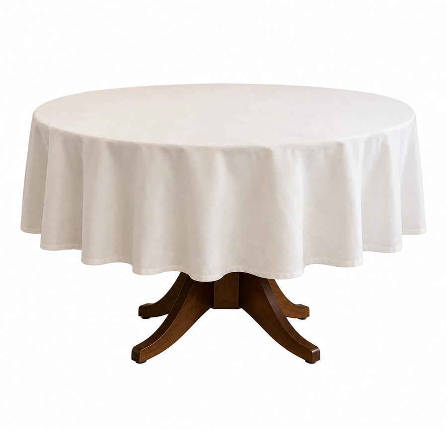 Round Dining Table with White Tablecloth and Wooden Pedestal Base