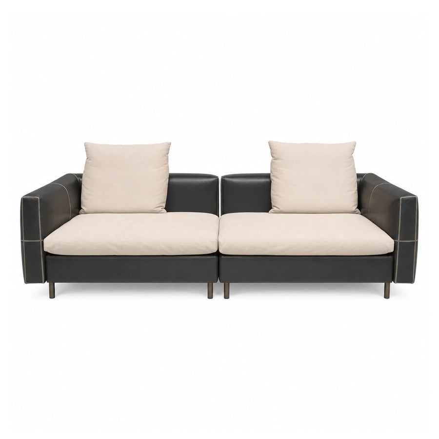 Modular Two-Seat Sofa with Cream Cushions and Dark Leather Frame
